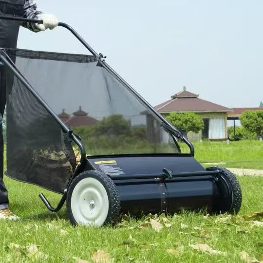 A push lawn sweeper that collects fallen leaves and grass clippings.
