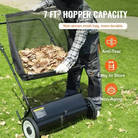 A push lawn sweeper that collects fallen leaves and grass clippings.